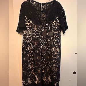 Blue lace fitted dress with a cream slip underneath